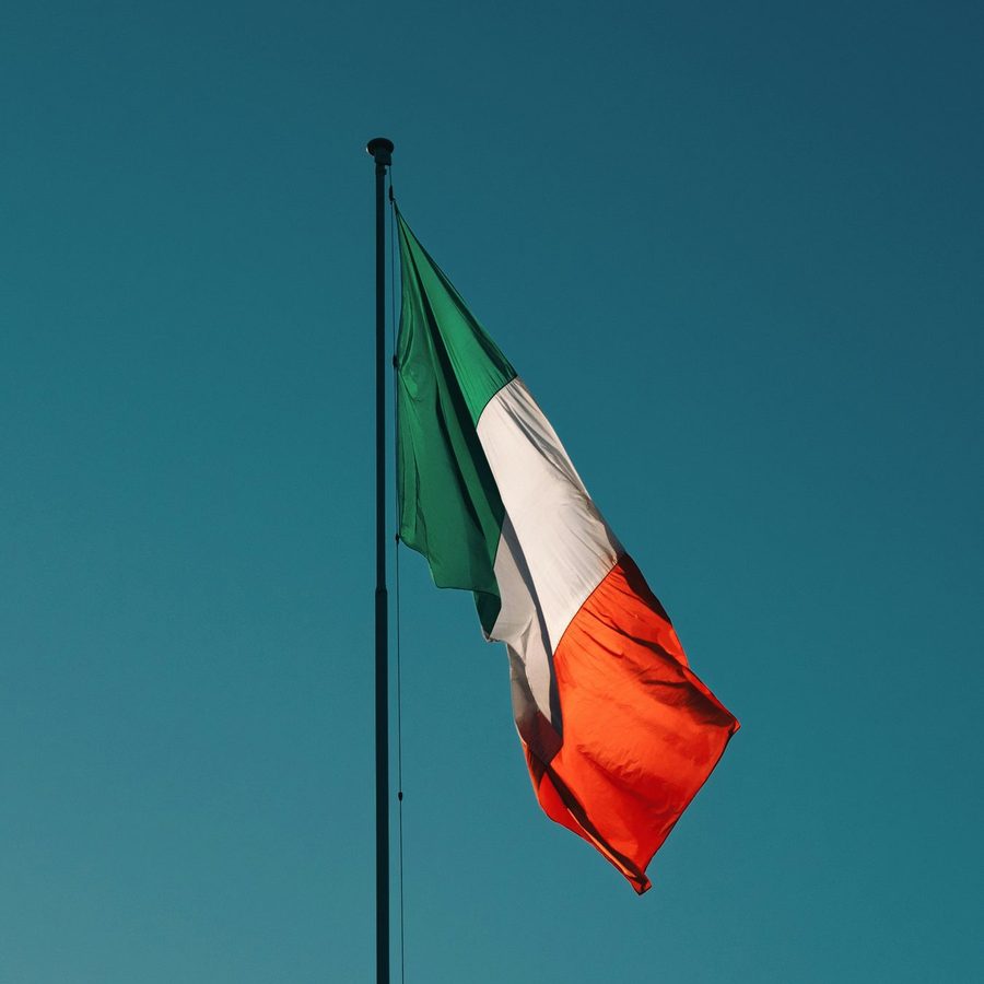 An Italian passport and documents on a desk