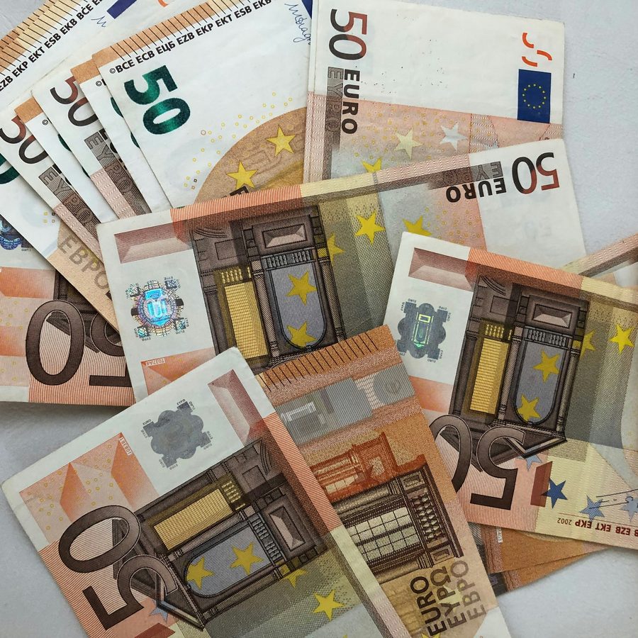 Euro banknotes spread out on a table